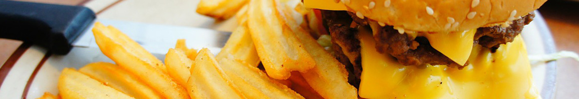 Eating Burger Hot Dog at Ron's Hamburgers & Chili restaurant in Claremore, OK.